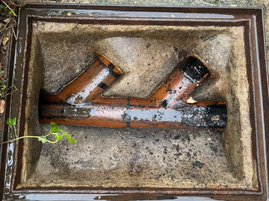 Junction chamber opened up showing the pipe runs